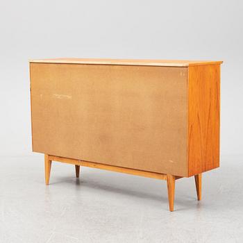 A mid 20th century teak veneered sideboard.