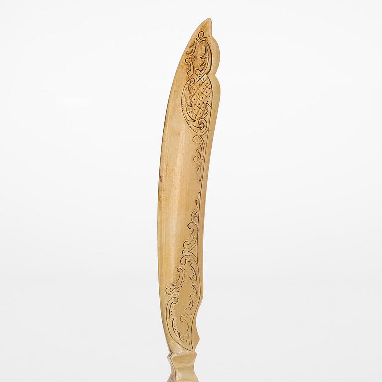 A 12-piece set of parcel-gilt fruit cutlery, and a silver butter knife, maker's mark Iisakki Saha, Pori 1898-1899.