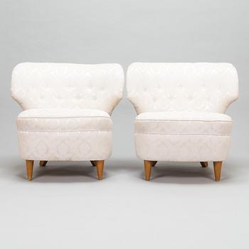 A pair of 1950's armchairs.