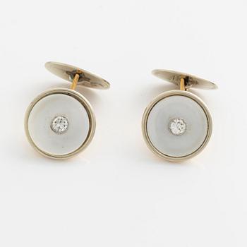 Cufflinks with mother-of-pearl and brilliant-cut diamonds.