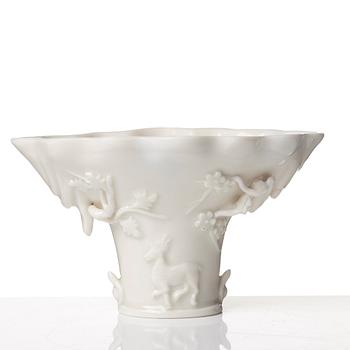 A blanc de chine rhinoserous libation cup, Qing dynasty, Kangxi (1662-1722).