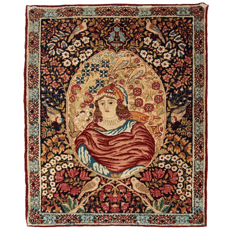 A RUG. A semi-antique Kerman Laver figural. 79,5 x 64,5 cm.