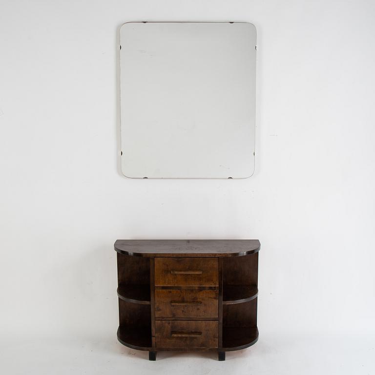 A stained birch chest of drawers and mirror, 1930's.