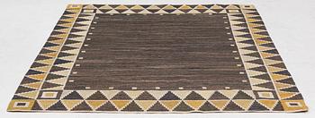 A flat weave rug, c. 245 x 185 cm.
