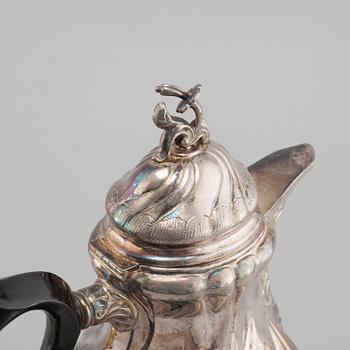 A silver rococo style coffee pot, sugar bowl and creamer from GAB and C G Hallberg in Stockholm, 1950s/60s.