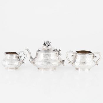 A Silver Teapot, Sugar Bowl and Creamer, France and England, 19th Century.