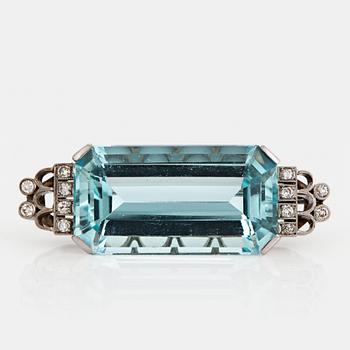 1069. A CF Carlman brooch in 18K white gold set with a faceted aquamarine and eight-cut diamonds.