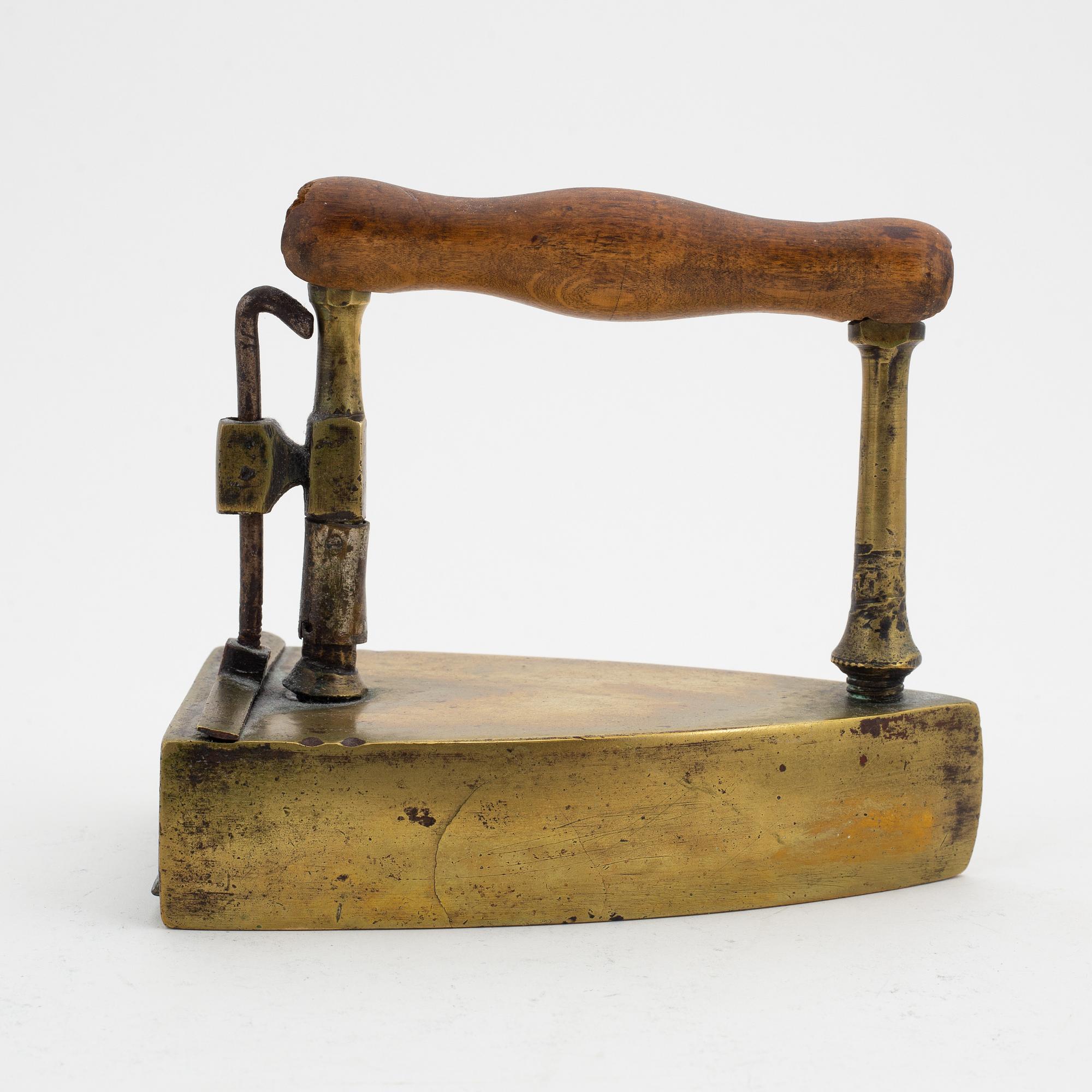 A set of four Swedish brass irons, 18th/19th Century.