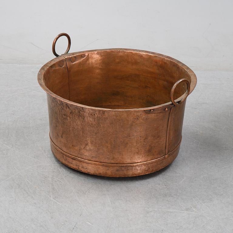 An 19th Century copper cauldron.