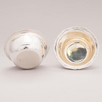 A lidded silver sugar bowl and a set of six silver bowls, Germany.