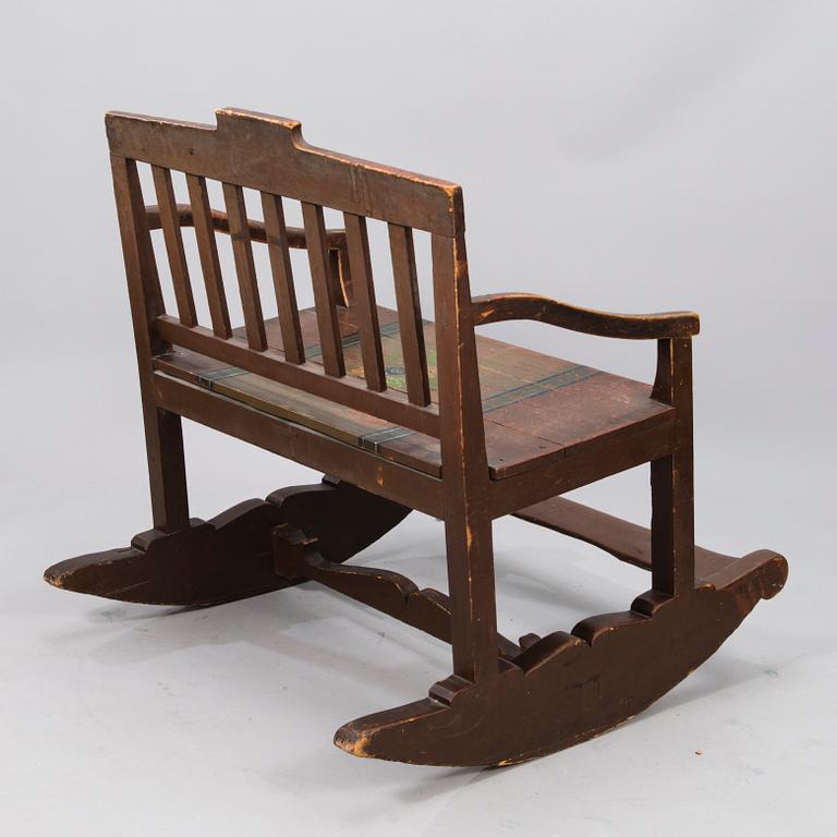 A 19th century wooden rocking chair.