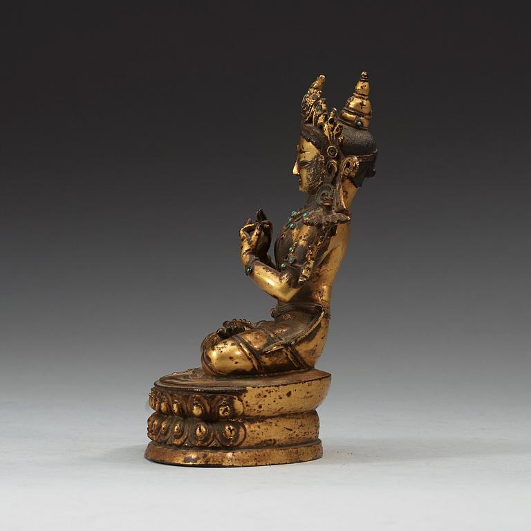 A gilt copper alloy figure of Manjushri, Nepal 15th/16th Century.