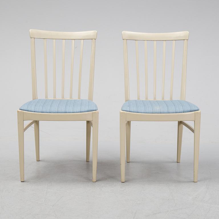 A dining table with six chairs by Carl Malmsten, second half of the 20th Century.