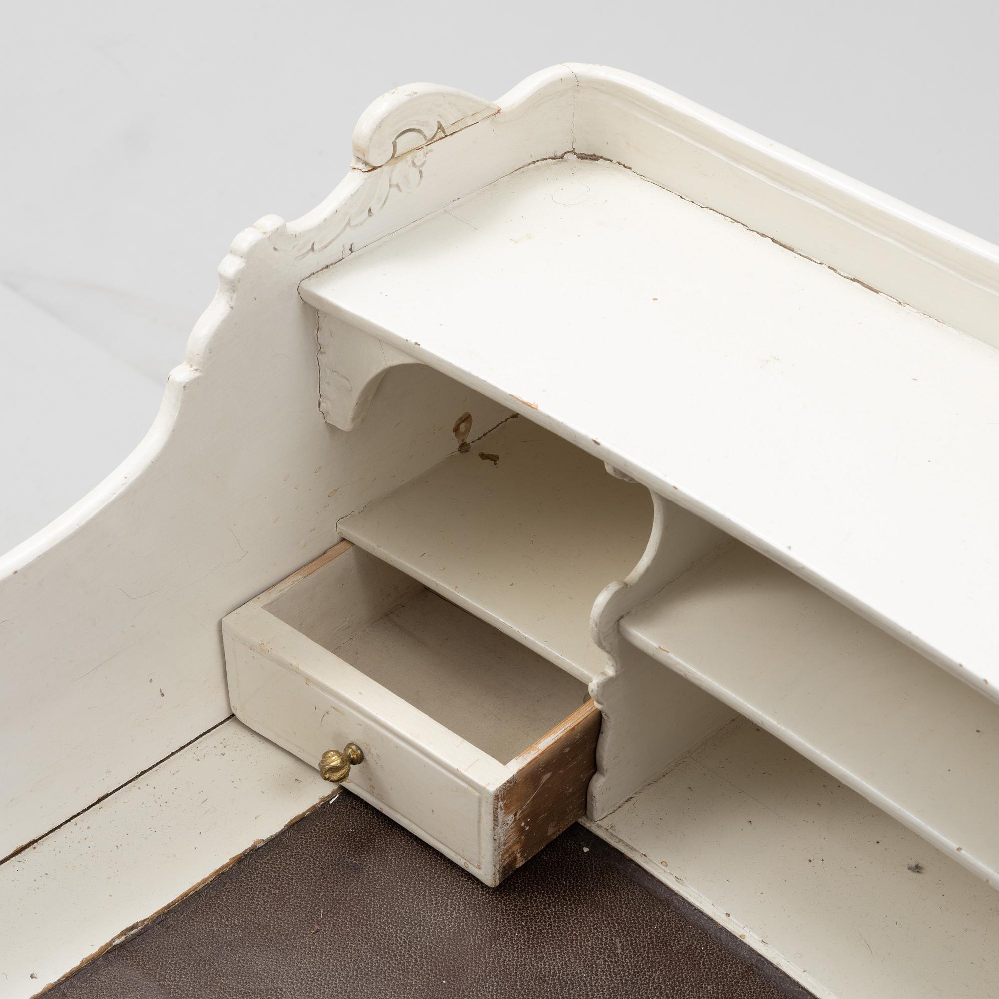 A painted rococo writing desk, mid 18th Century with later parts.