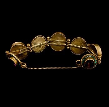 ARMBAND, mässing och turkoser, 1900-talets första hälft.