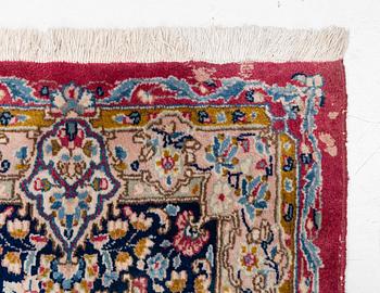 A Kirman carpet, signed, c. 388 x 279 cm.