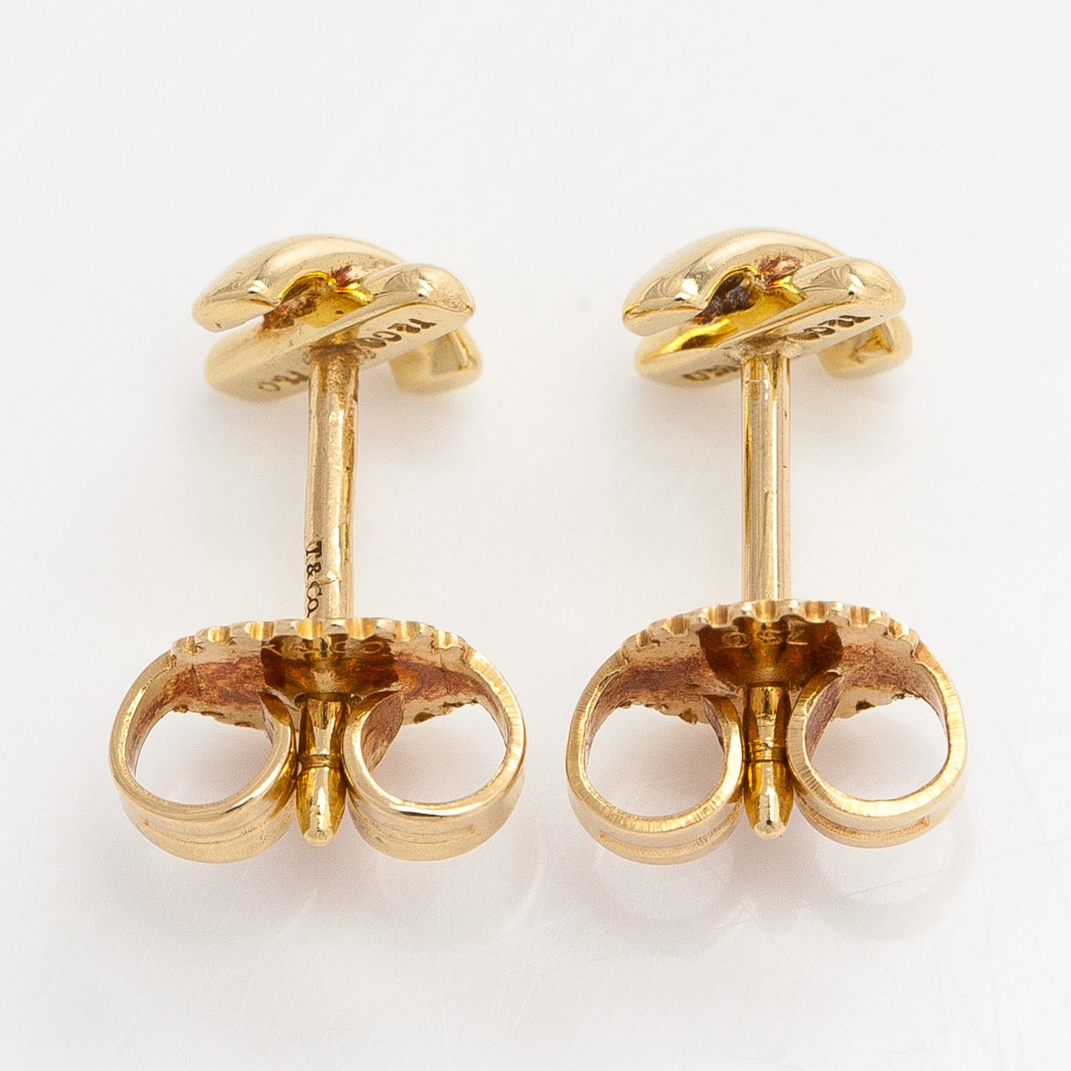 Tiffany & Co, a pair of 18K gold 'Cross Stitch' earrings.