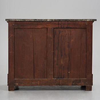 A French Empire mahogany commode, early 19th century.