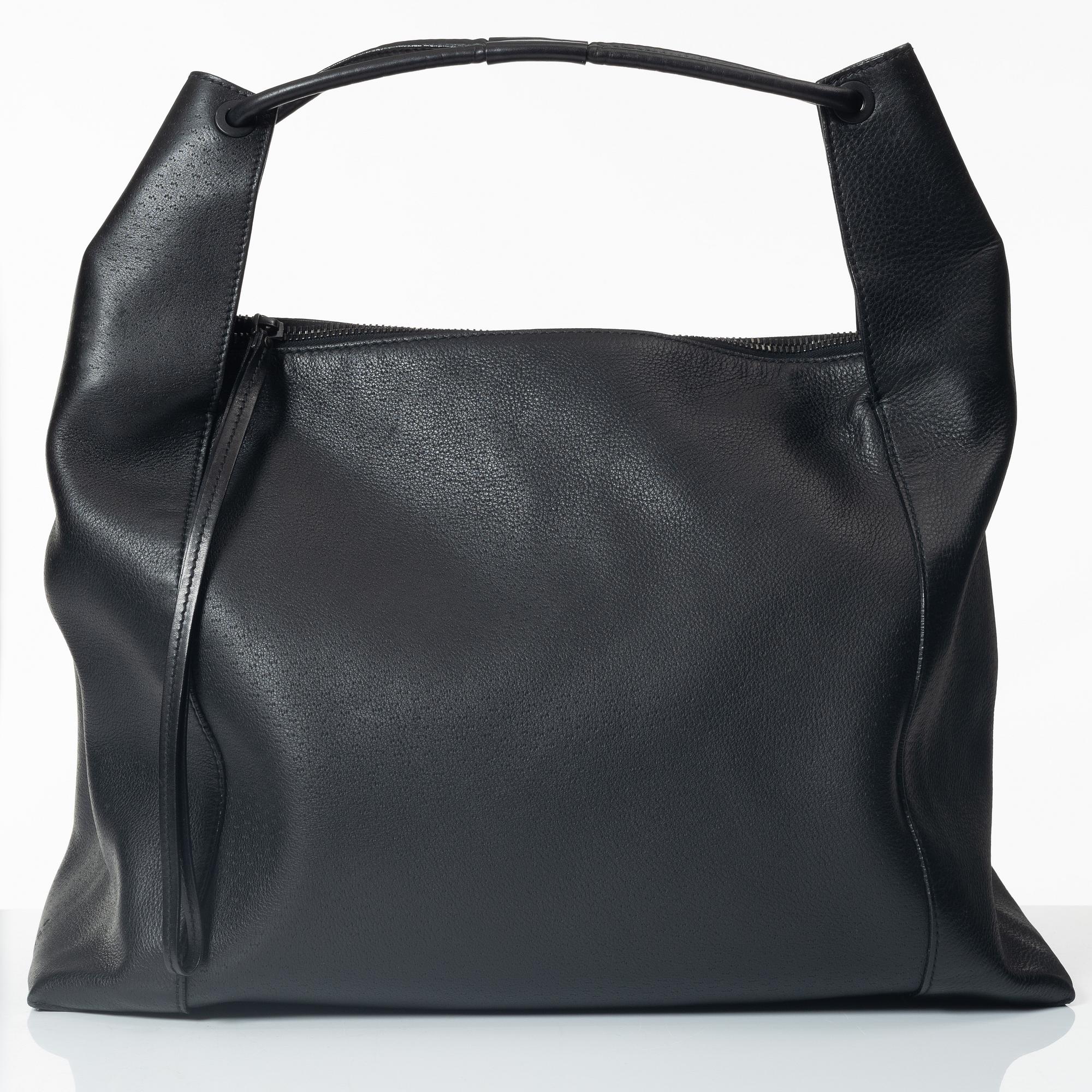 Gucci, A black leather hobo bag.