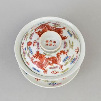 A Chinese 20th century famille rose porcelain cup with cover and dish, with Guangxus six character mark.