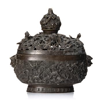 A bronze reticulated incense burner with cover, Qing dynasty (1644-1912).