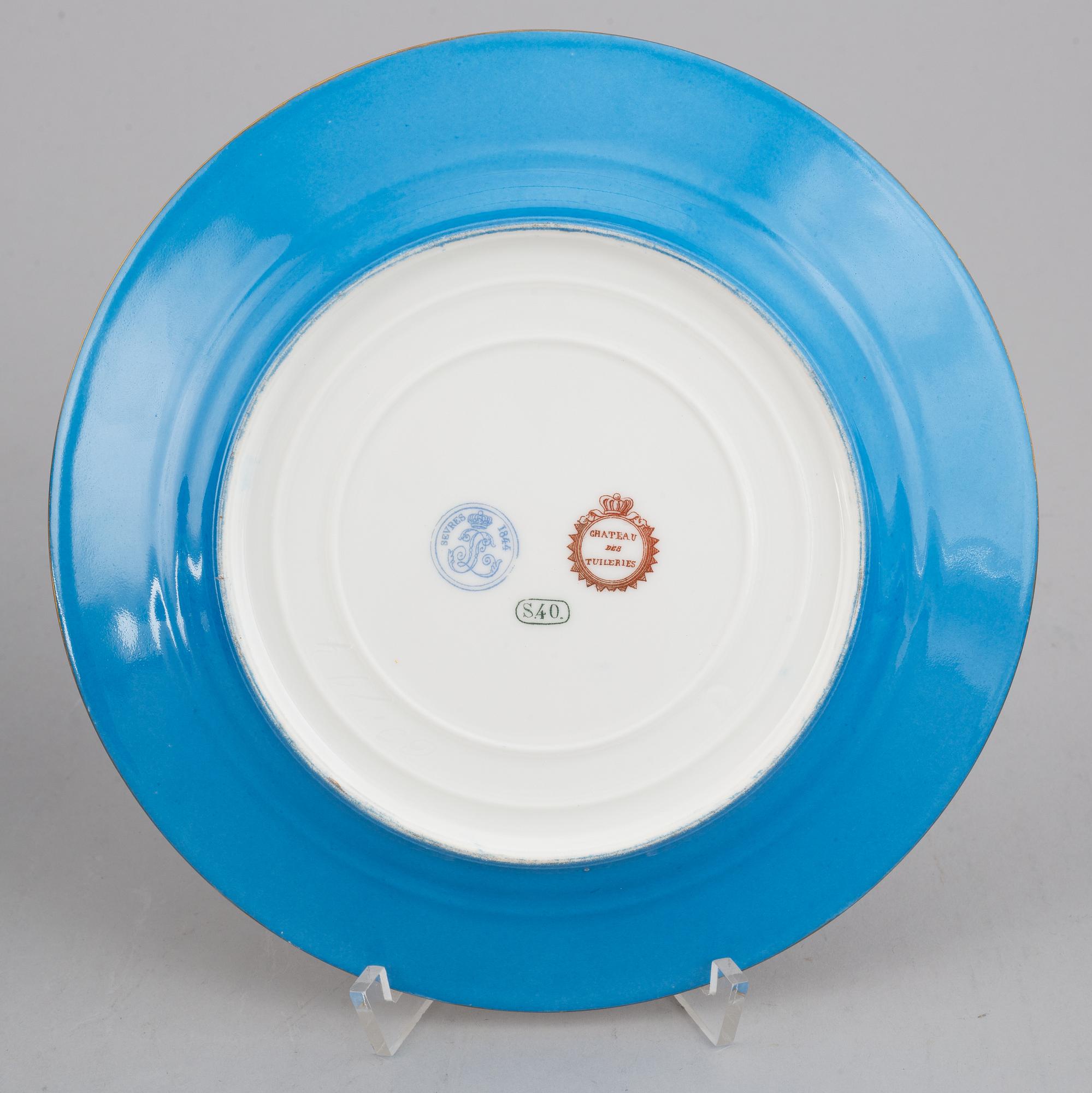 A set with two porcelain tazzas and 15 plates, France, "Sevrès", late 19th Century.
