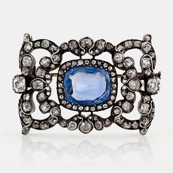 A WA Bolin brooch in 18K gold and silver set with a faceted sapphire ca 4.50 cts and old- and rose-cut diamonds.