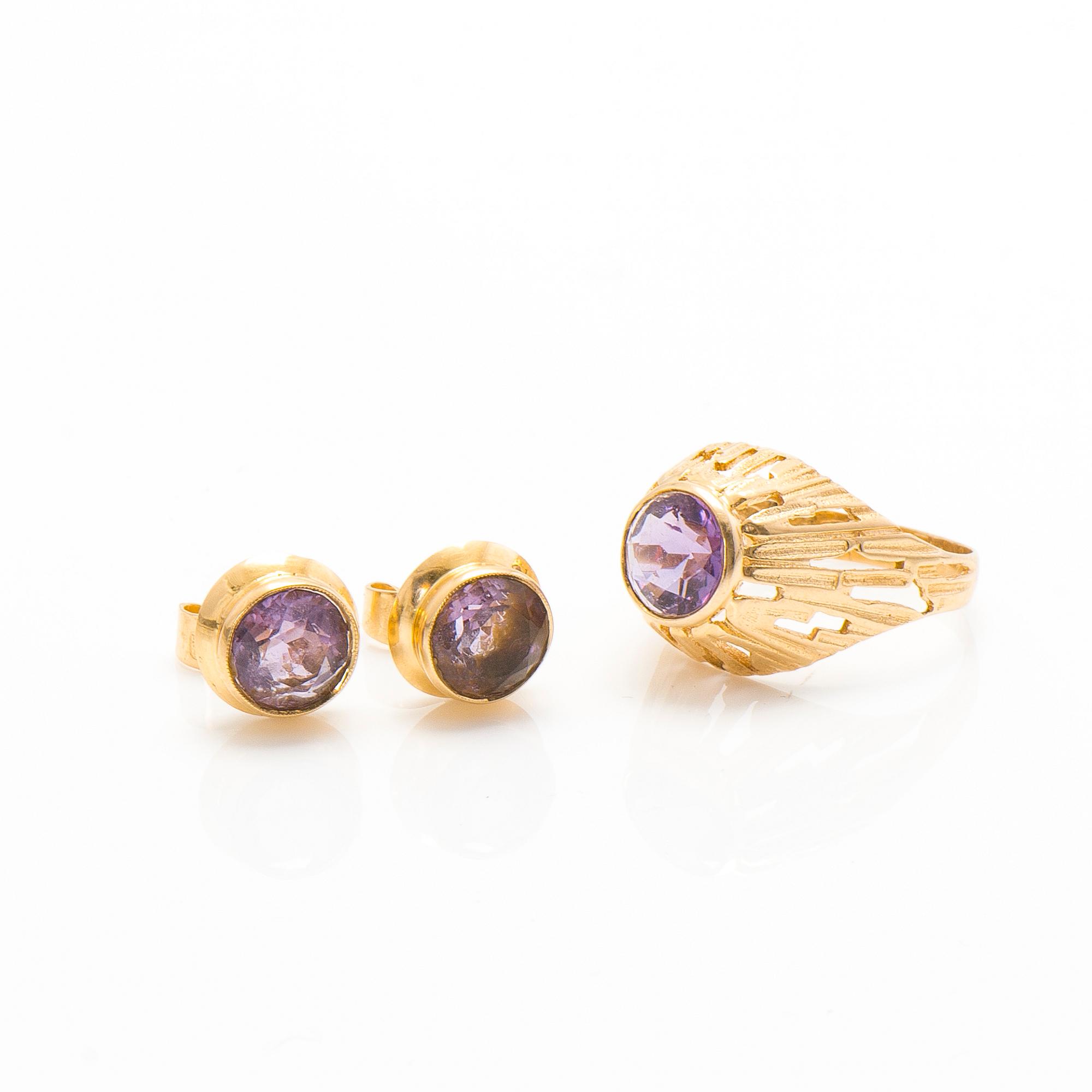 A set of 14K gold earrings and a ring with amethysts.