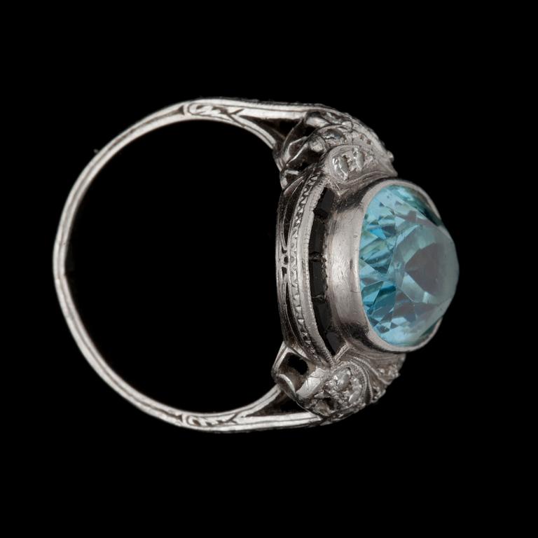 An aquamarine and onyx ring.