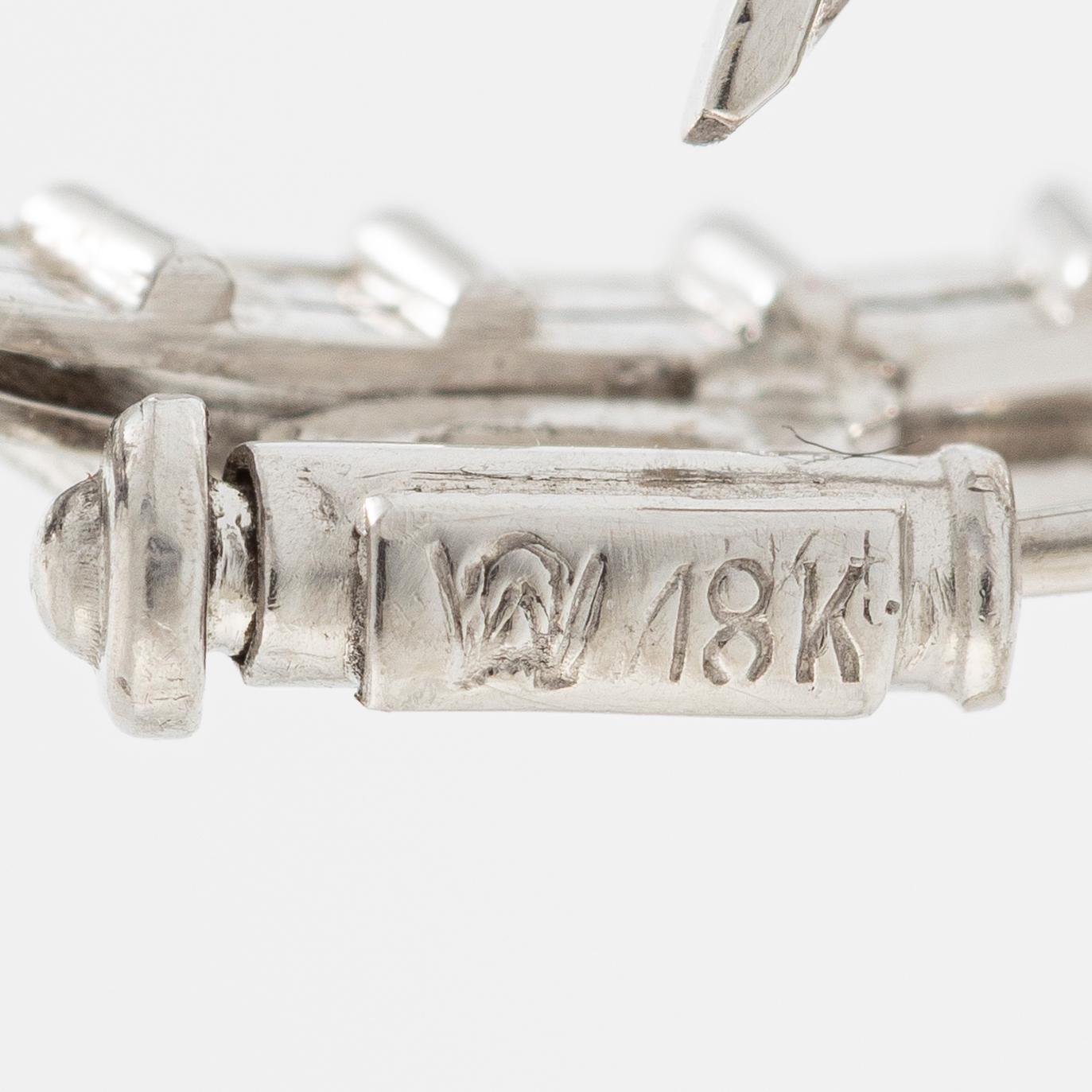 Brooch, 18K white gold set with brilliant-cut, marquise-cut, octagonal-cut, and baguette-cut diamonds.