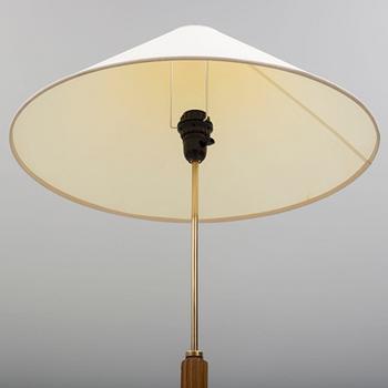 A Bergboms brass and beech standard light, 1940's.