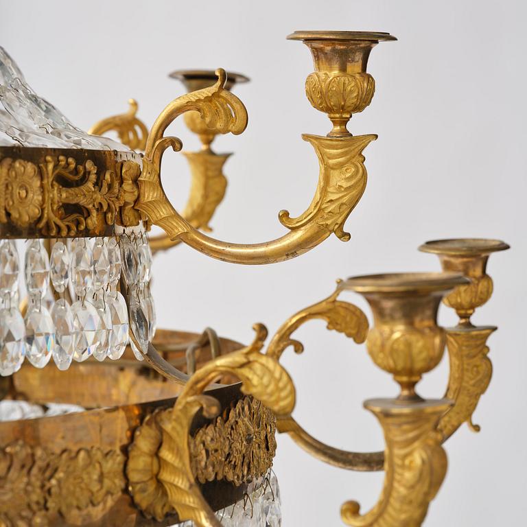An ormolu and cut glass sixteen-branch Empire chandelier, Paris, early 19th century.