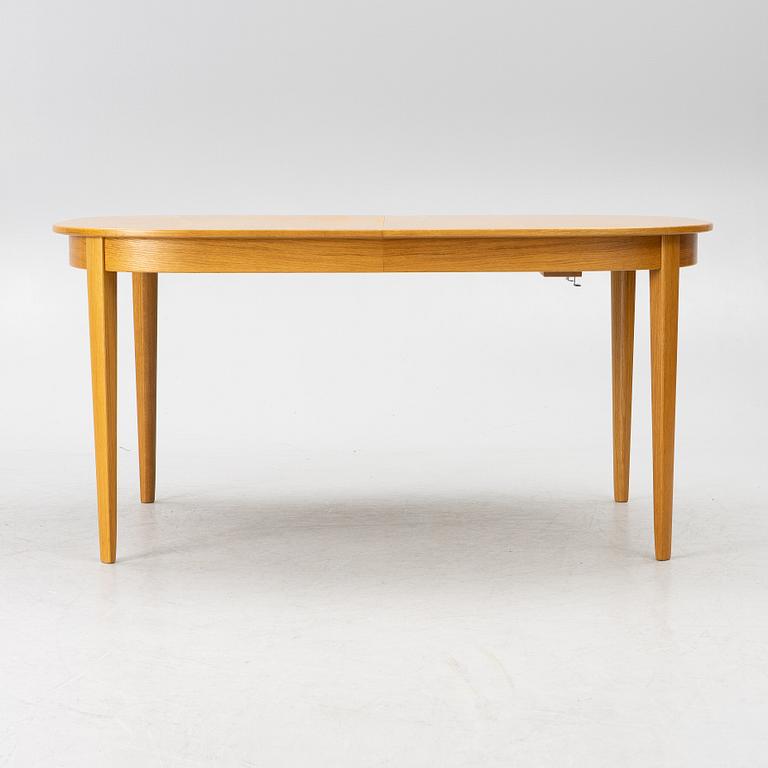 Carl Malmsten, a dining table with eight chairs, 'Camlare Nyckel', Sweden, second half of the 20th century.