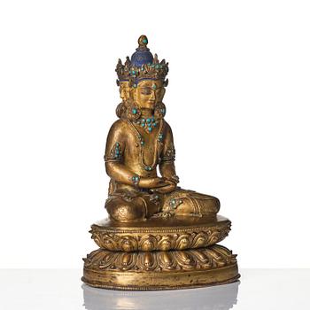 A Tibetan or Nepalese Gilt-Copper Alloy Figure of Sarvavid Vairocana, 15th century.