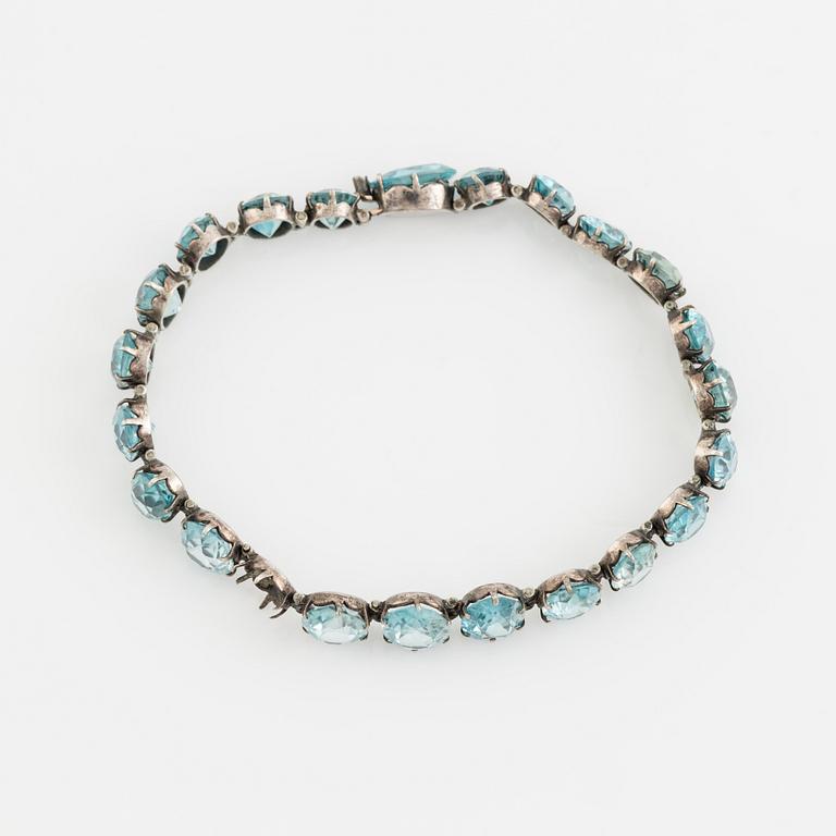 Silver and blue zircon bracelet.