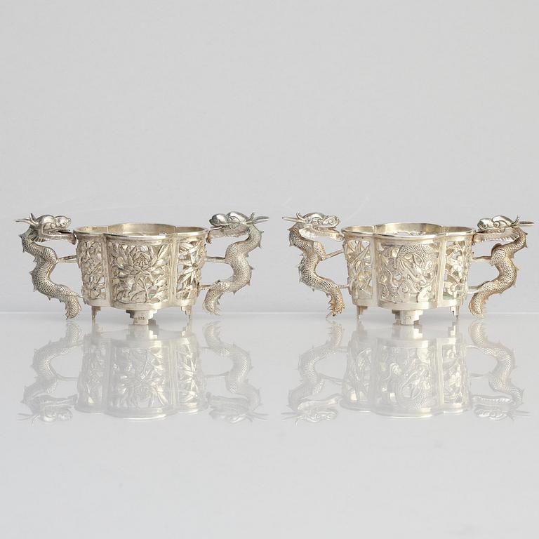 A pair of  Chinese silver cup holders/salts, 20th century.