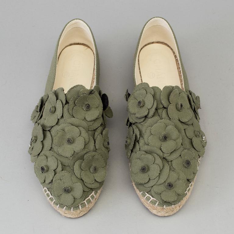 A pair of espadrilles from Chanel.