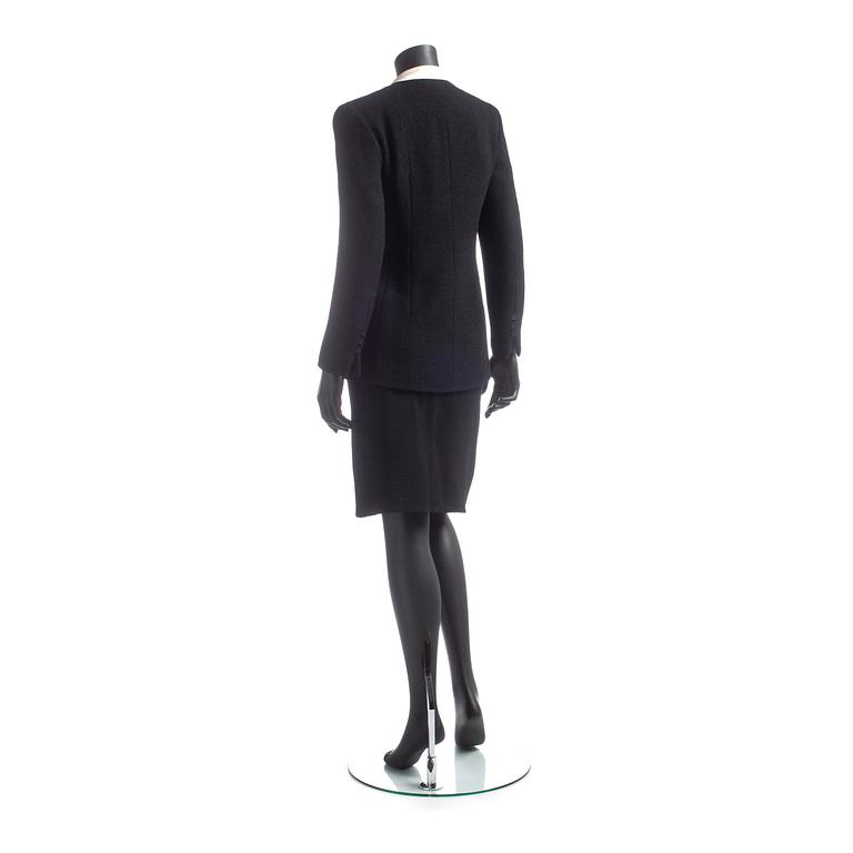 CHANEL, a two-piece suit consisting of jacket and skirt.