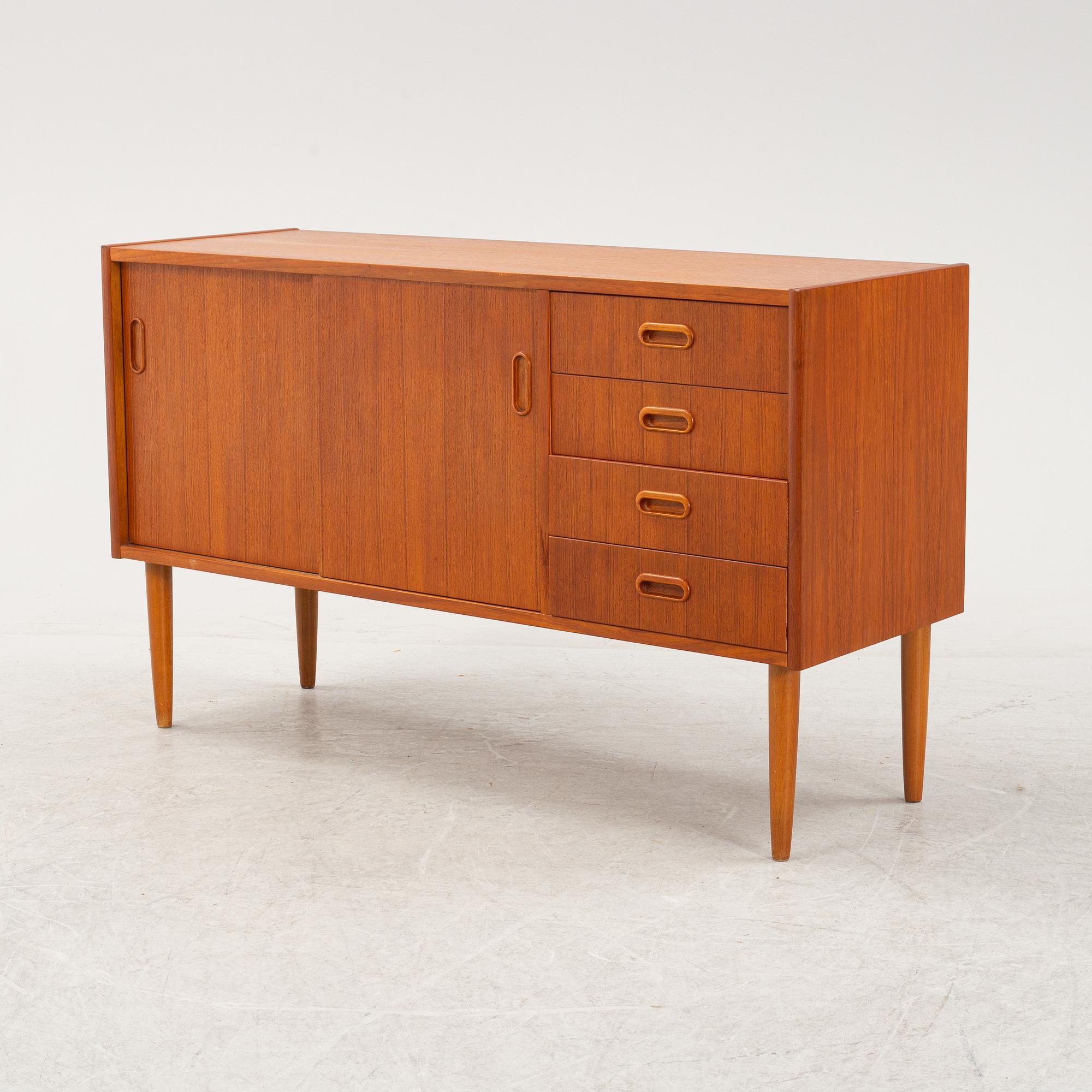 A 1950's teak veneered sideboard.