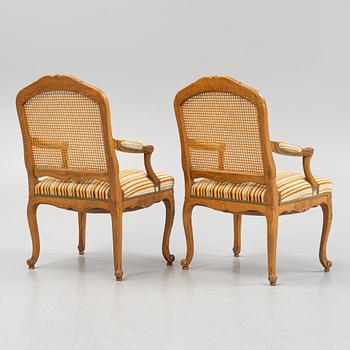 A pair of Louis XV-style open armchairs, 20th century.