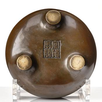 A bronze tripod censer, Qing dynasty (1664-1912).