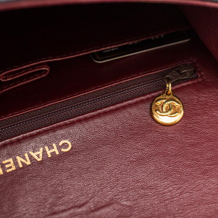 A "Double Flap bag" by Chanel.