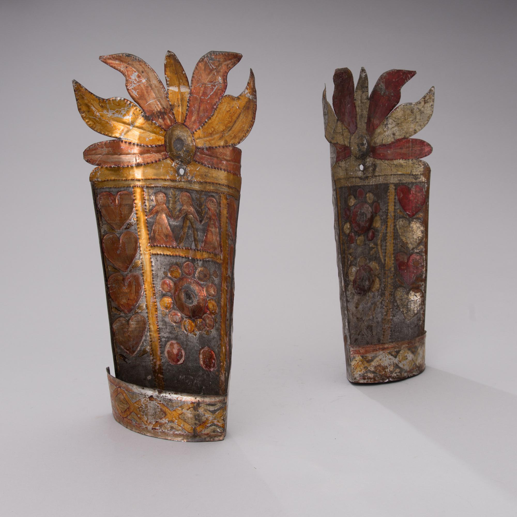 A pair of late 19th century tin wall sconces.