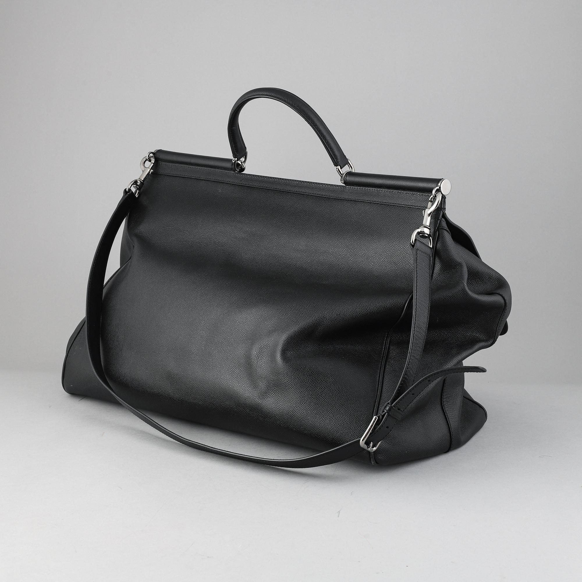 Dolce & Gabbana, a black leather weekend bag.