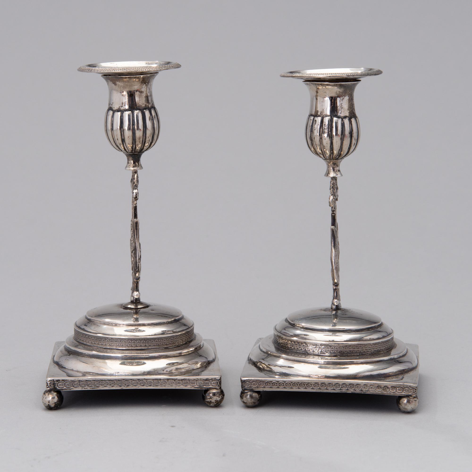 A PAIR OF FINNISH SILVER CANDLESTICKS, Wilhelm Fahlström 1818-1828, Helsinki.