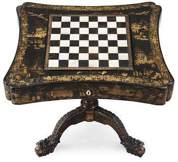 A lacquer games table. Qing dynasty, 19th Century.