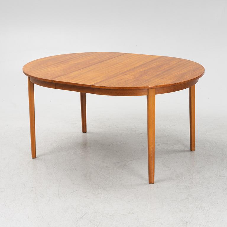 A teak-veneered dining table, second half of the 20th century.