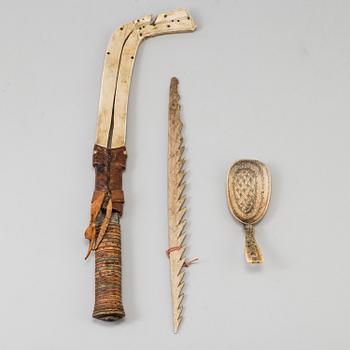 A set of 3 Sami objects, a knife by Anders Niia, 1929, a spoon and a Spear tip, beginning of  20th century.