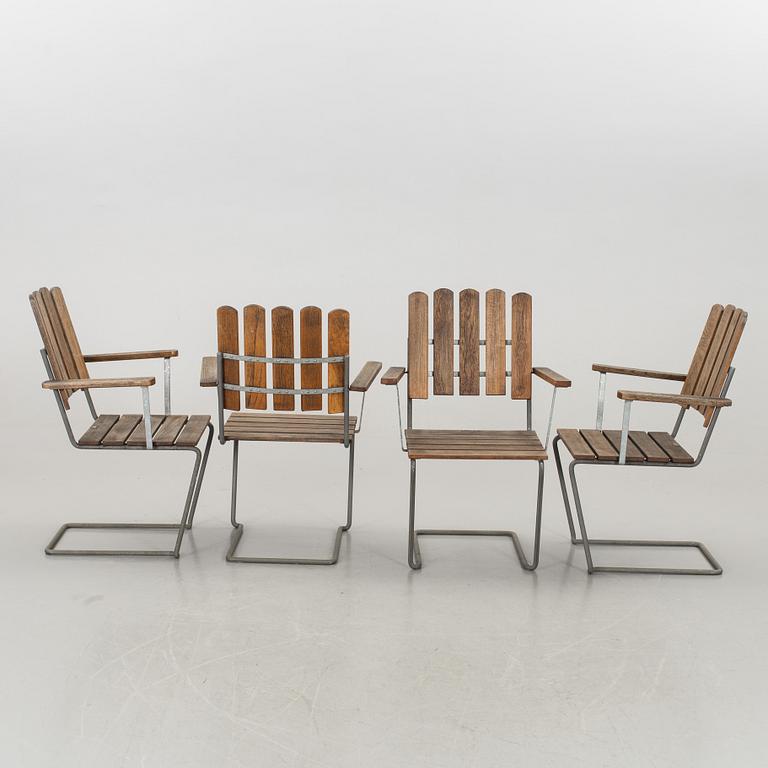 A GARDEN TABLE AND FOUR ARMCHAIRS FROM GRYTHYTTAN.