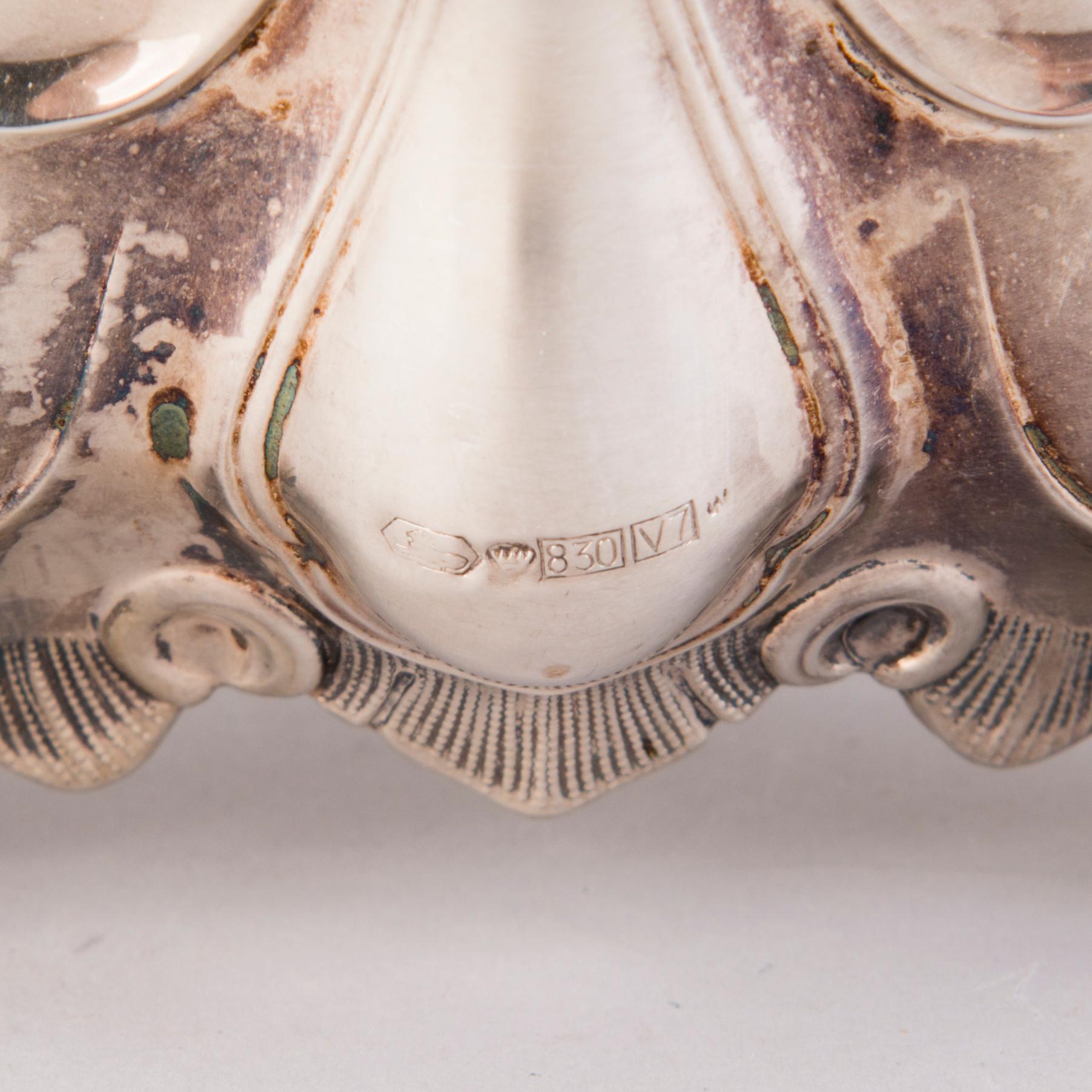CANDELABRUM AND CANDLESTICK, silver, Kultakeskus Oy, Hämeenlinna, 1965 and 1975.